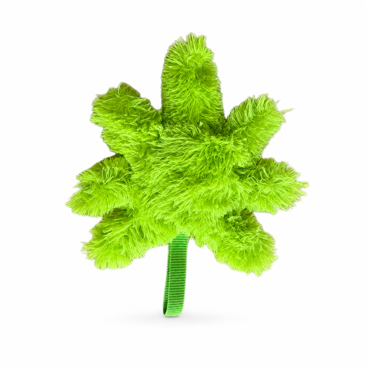Vista trasera del juguete de peluche Herb de Verný, mostrando únicamente la textura de felpa verde brillante en forma de hoja y la cinta de sujeción verde en la base
